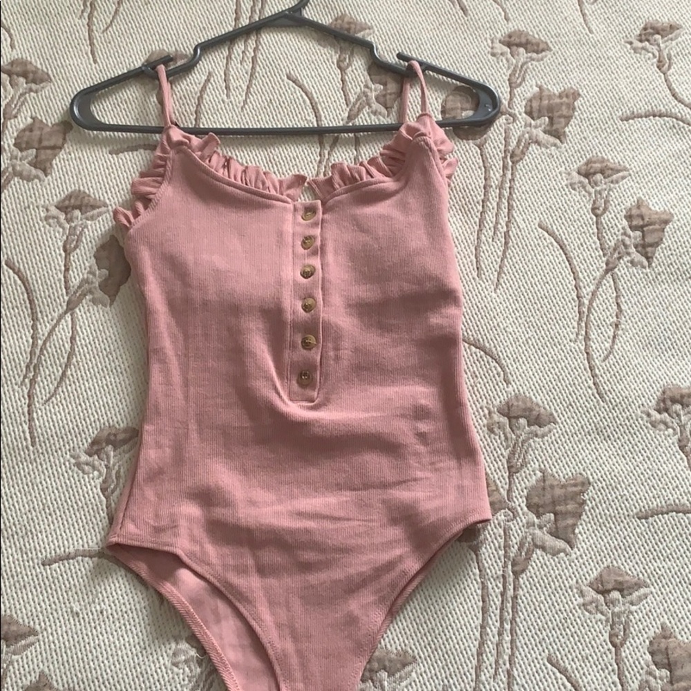 Pink body suit